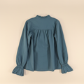 Blouse à jabots coupé bord franc